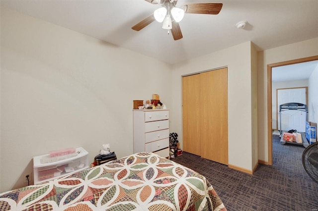 bedroom featuring ceiling fan, a closet, and dark colored carpet