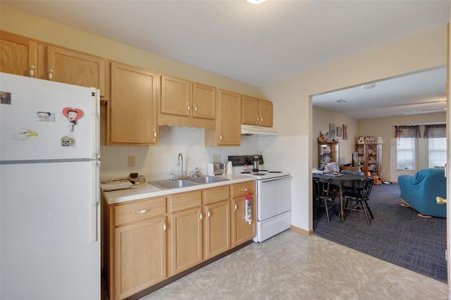 kitchen featuring light brown cabinetry, sink, white appliances, and decorative backsplash