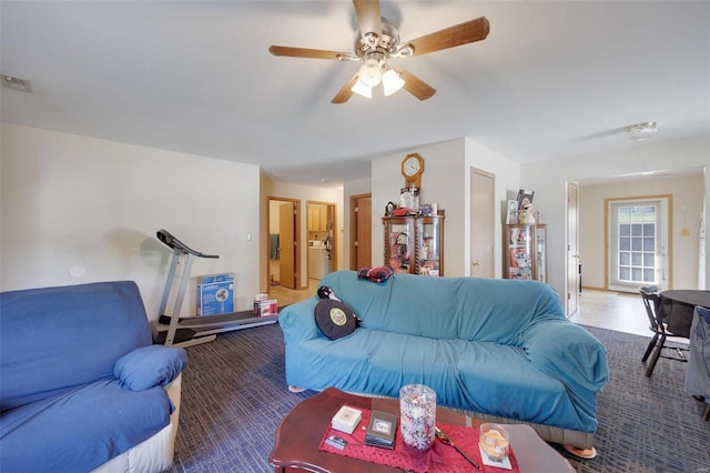 carpeted living room featuring ceiling fan