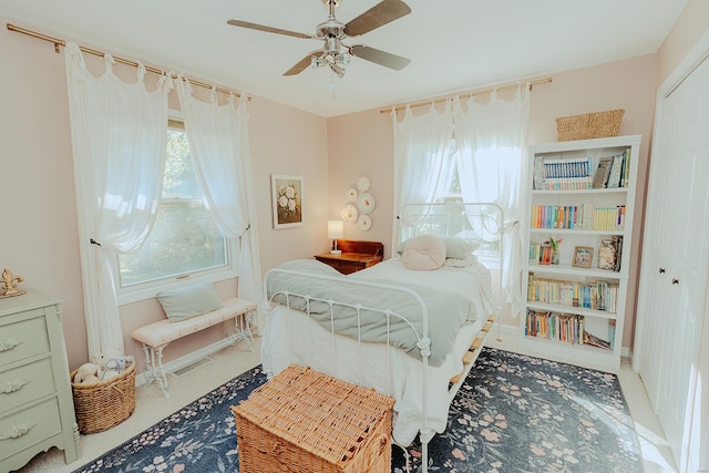 bedroom featuring ceiling fan and a closet