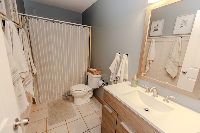 bathroom with tile patterned floors, toilet, and vanity