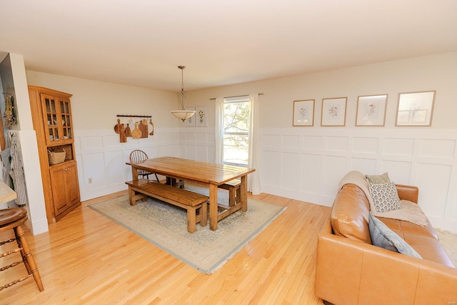 dining area featuring light wood-type flooring