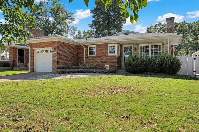 ranch-style house featuring a front lawn and a garage