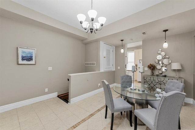 dining area featuring an inviting chandelier and light tile patterned flooring