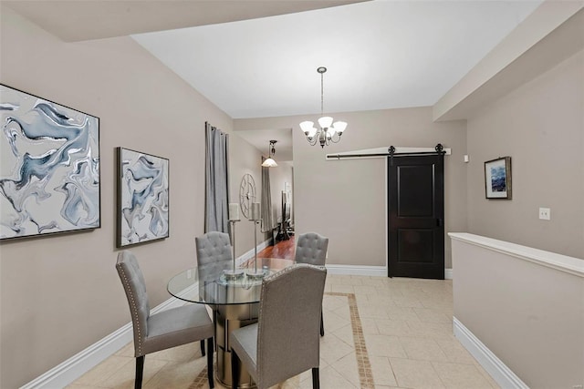 dining space featuring light tile patterned floors, a barn door, baseboards, and an inviting chandelier