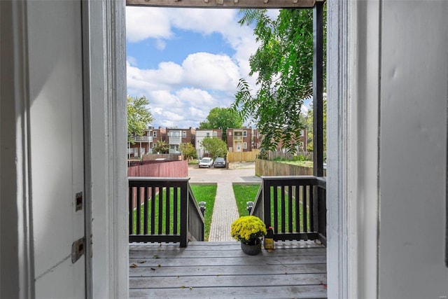 doorway to outside with hardwood / wood-style flooring and a residential view