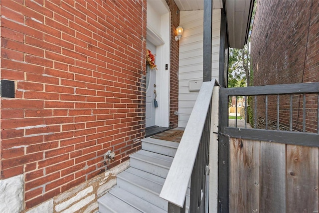 property entrance with brick siding