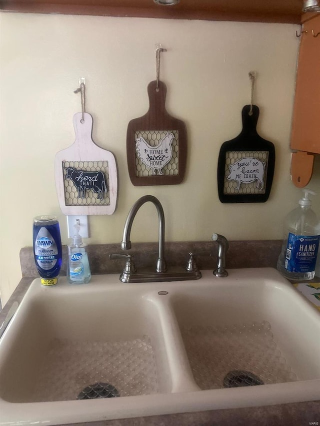 room details featuring decorative light fixtures and sink