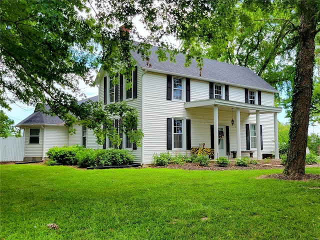 colonial home with a front yard