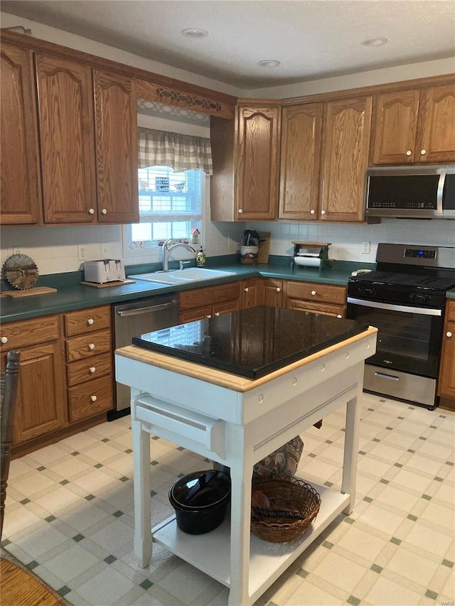 kitchen featuring appliances with stainless steel finishes and sink