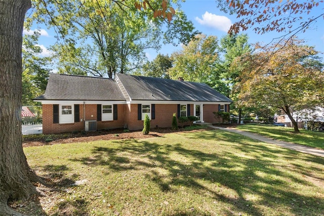 ranch-style home with a front lawn