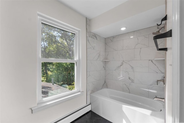 bathroom featuring tiled shower / bath