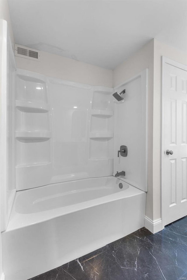 bathroom with shower / bathtub combination