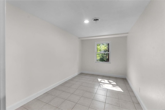 spare room with light tile patterned floors