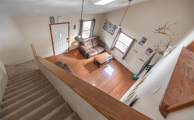 living room featuring a skylight