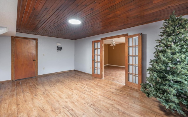 unfurnished room with french doors, light wood-type flooring, and wood ceiling