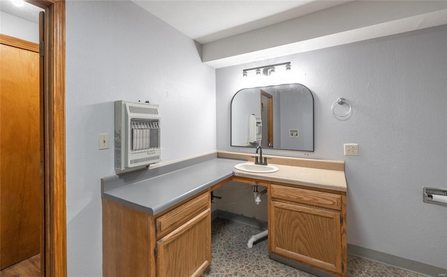 bathroom with vanity and heating unit