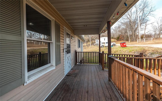 wooden deck featuring covered porch