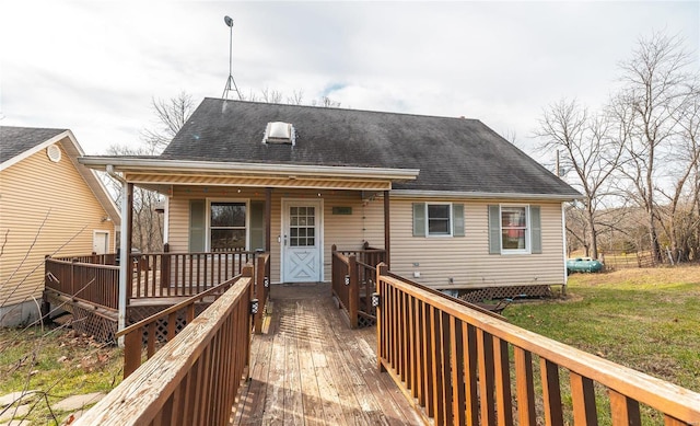 rear view of house with a lawn