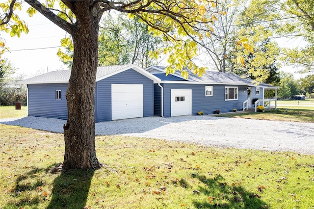 view of home's exterior with a garage and a yard