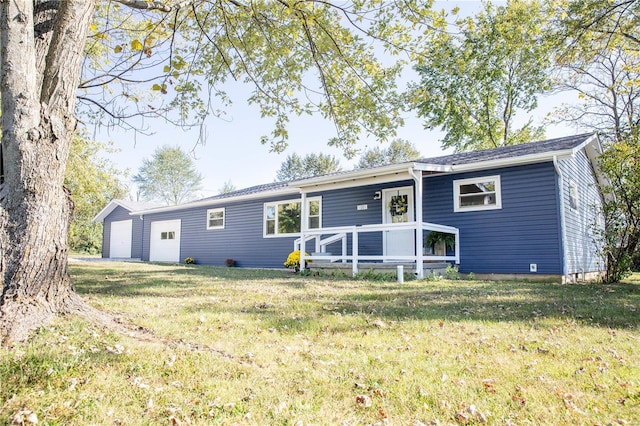 ranch-style home with a front yard and a garage