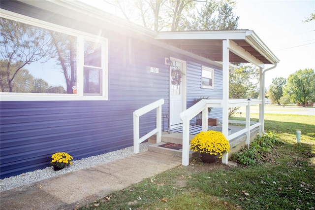 property entrance with covered porch