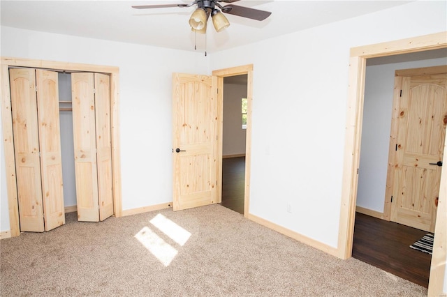 unfurnished bedroom featuring ceiling fan and carpet