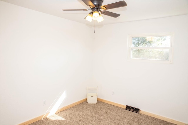 unfurnished room featuring light carpet and ceiling fan