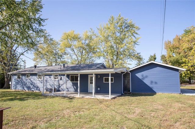 back of property featuring a lawn and a patio area