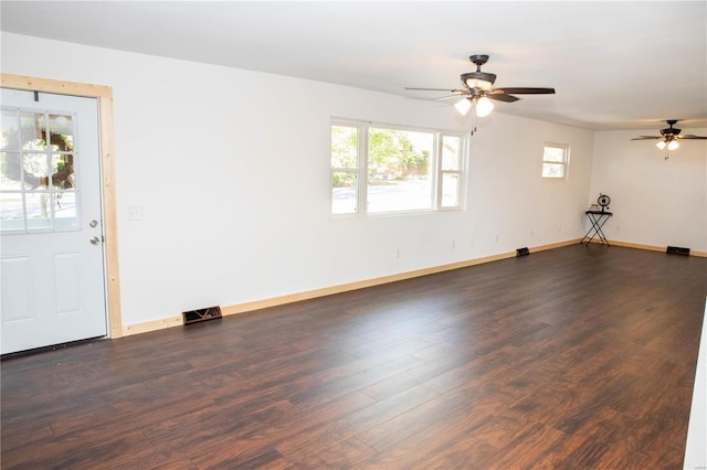 interior space with dark wood-type flooring and ceiling fan