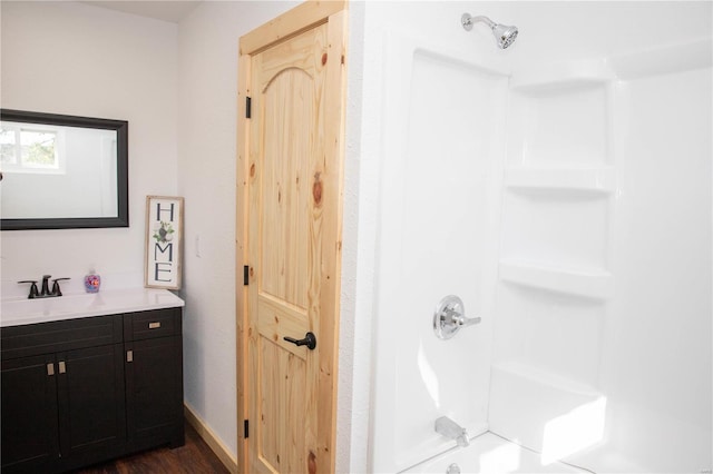 bathroom featuring vanity and hardwood / wood-style floors