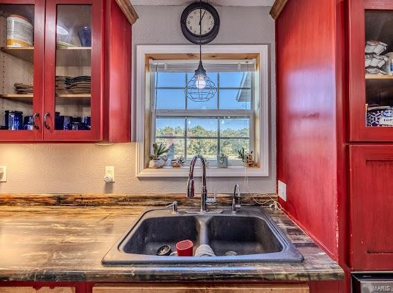 kitchen featuring hanging light fixtures and sink