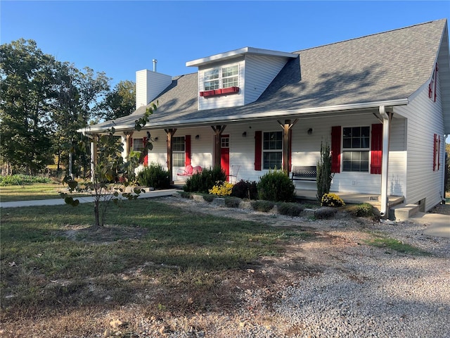 view of front of home with a front lawn and a porch