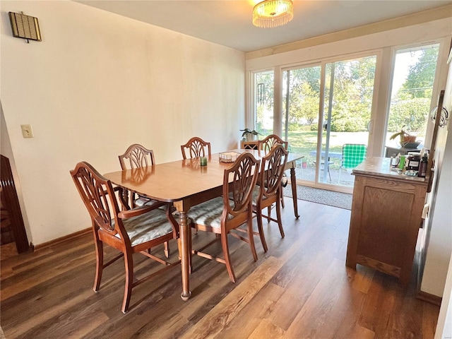 dining space featuring dark hardwood / wood-style flooring