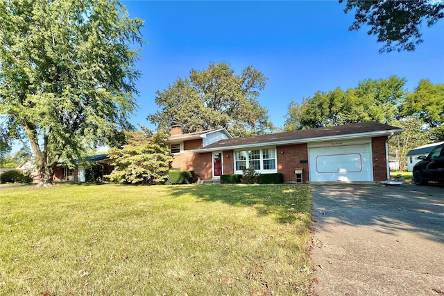 view of front facade with a front yard and a garage