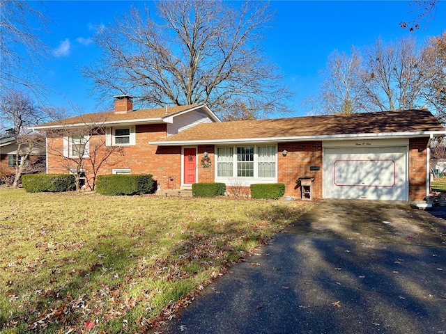 view of front of home with a garage and a front yard