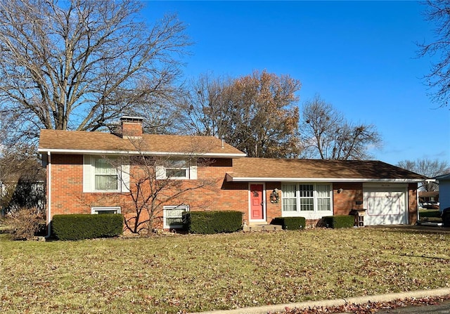 view of front of house with a front lawn and a garage