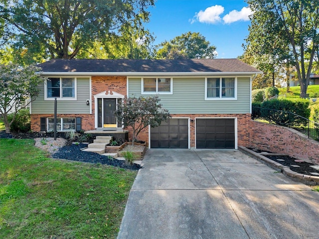 bi-level home with a garage and a front yard