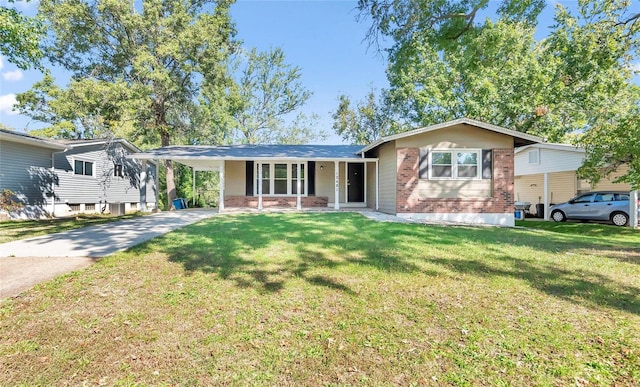 single story home with a front lawn and a carport