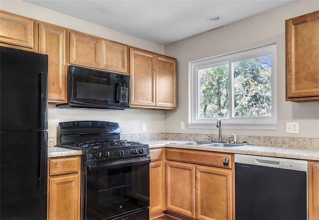 kitchen featuring black appliances and sink