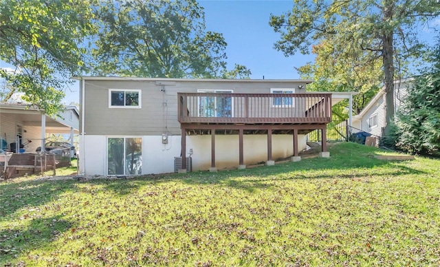 back of property with central AC unit, a yard, and a deck