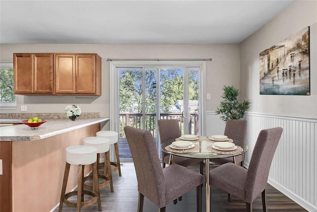 dining area with dark wood-type flooring