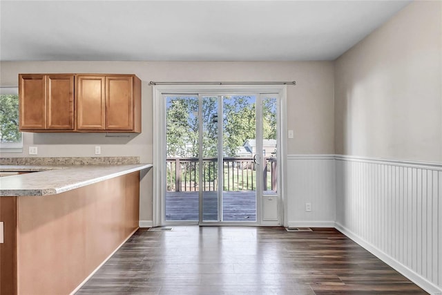 doorway to outside featuring dark hardwood / wood-style floors