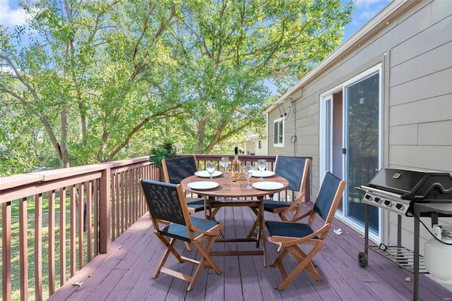 wooden terrace featuring area for grilling