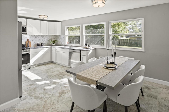 dining room featuring sink