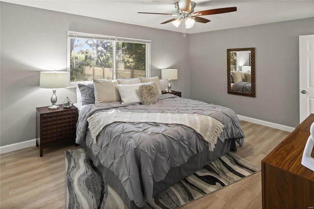 bedroom with ceiling fan and light wood-type flooring