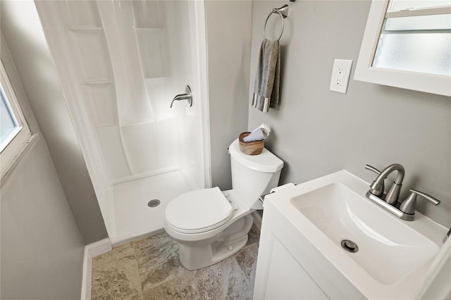 bathroom with vanity, toilet, and curtained shower