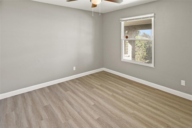 empty room with light hardwood / wood-style flooring and ceiling fan