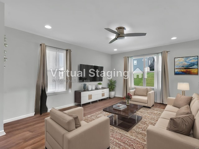 living room with hardwood / wood-style flooring and ceiling fan