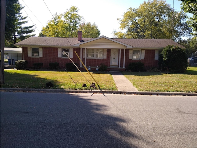 ranch-style home with a front lawn